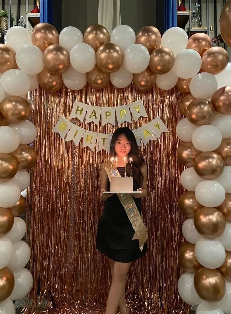 Rose gold and white birthday balloon setup